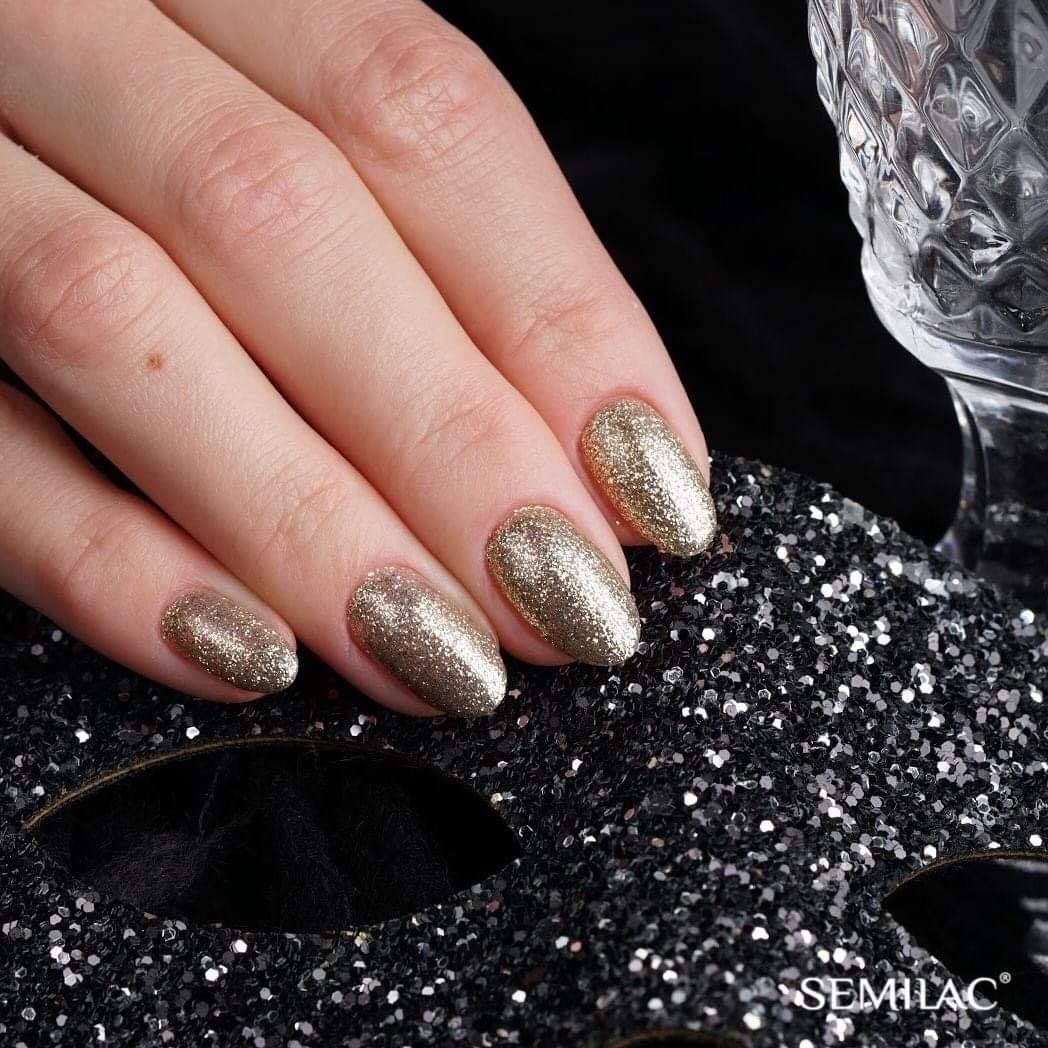 brokatowy lakier hybrydowy złoty manicure