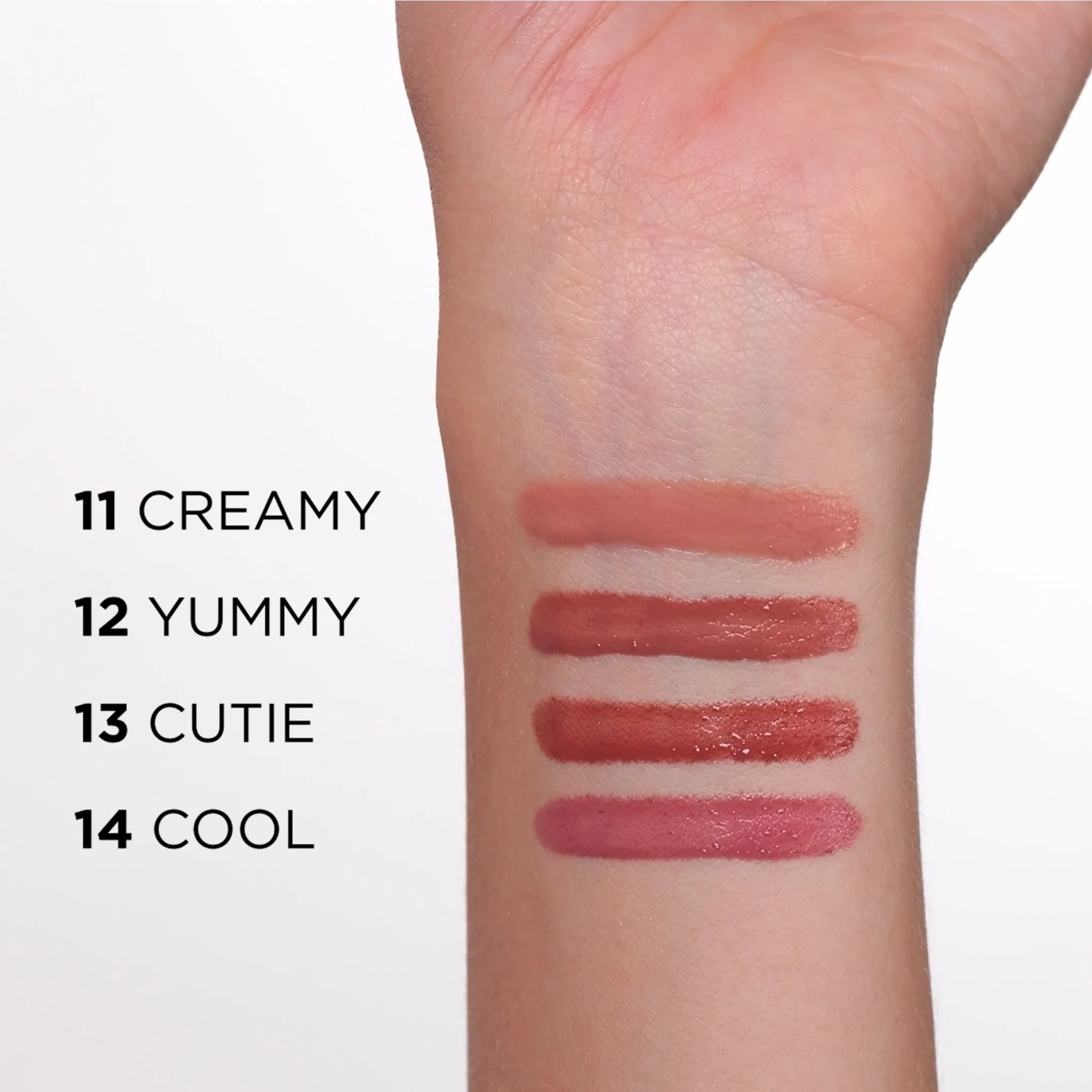 Swatche pomadki Eveline Vinylove na skórze – odcienie 11 Creamy, 12 Yummy, 13 Cutie i 14 Cool